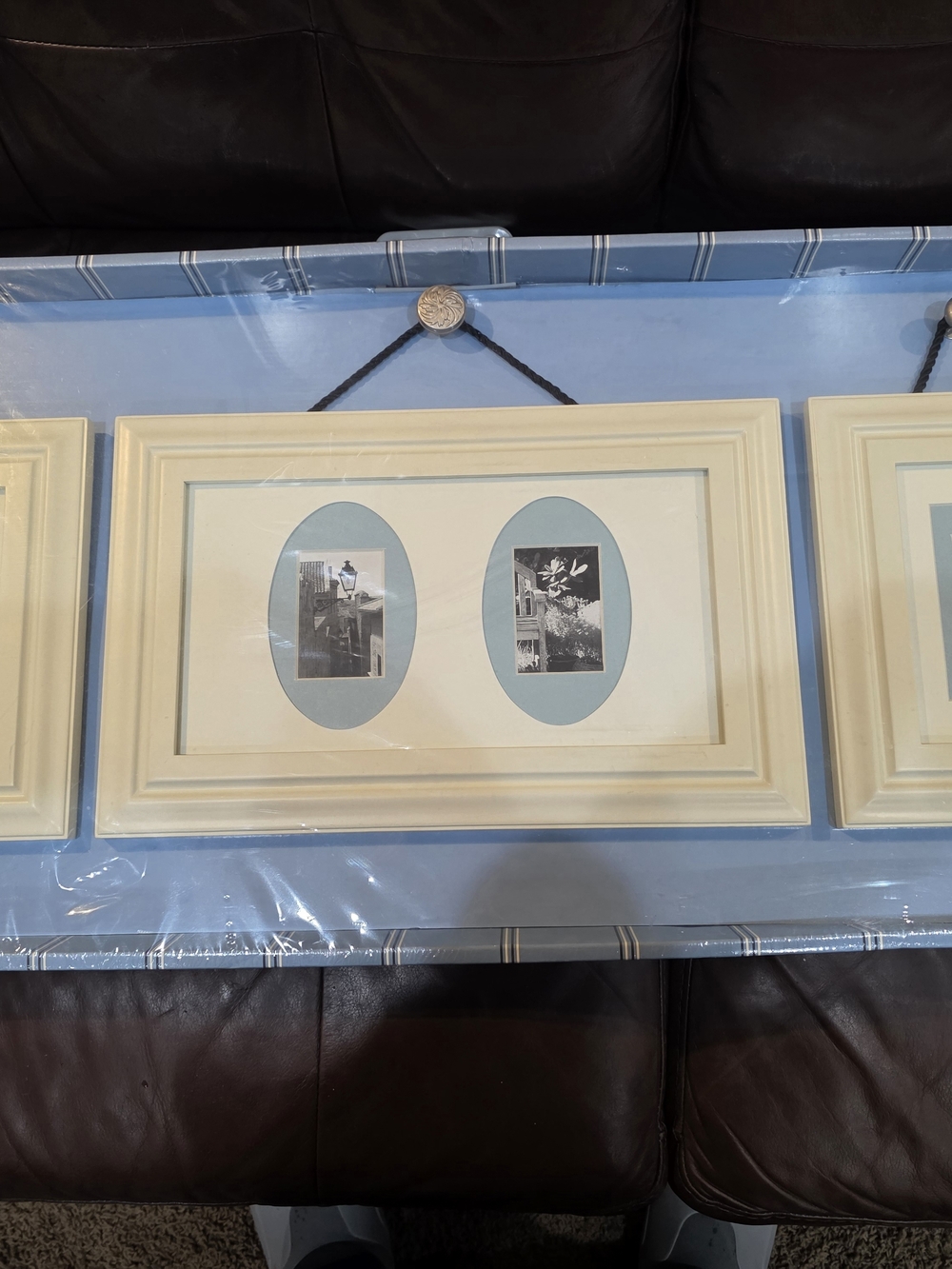 Fetco Cream Triple-Opening Wall Frame with Blue Mats